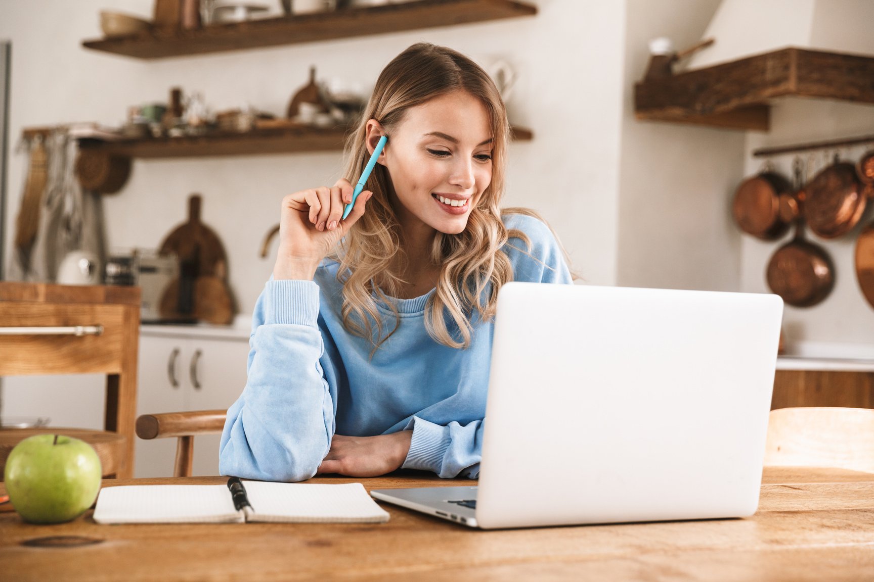 Woman Working on Laptop at Home